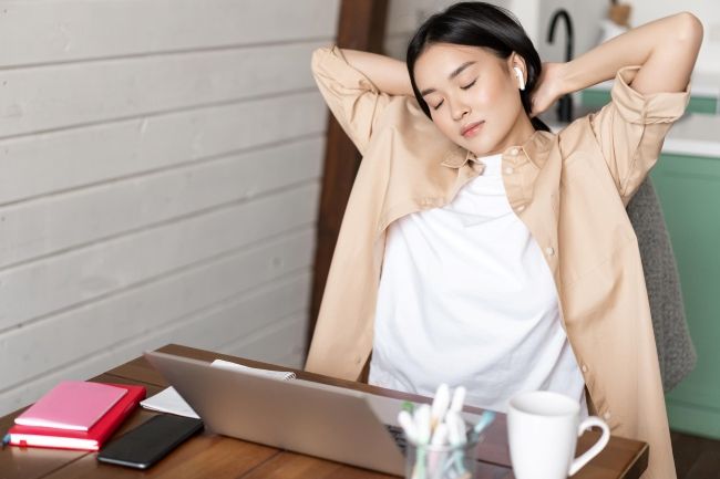 Tired Asian Girl Having Break From Working Stretching Arms After Doing Homework Laptop Sitting